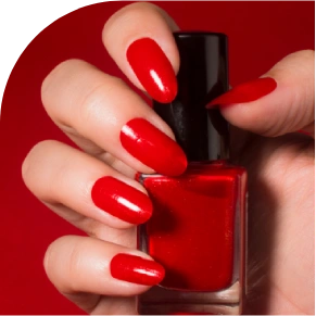 Red nails holding red nail polish